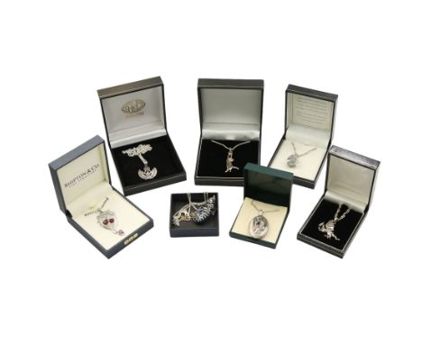 Six silver gem set pendant necklaces, including a jade dragon pendant, garnet Art Nouveau style pendant, moonstone Egyptian p