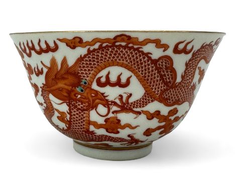 Chinese porcelain iron red tea bowl, the exterior painted with two five claw dragons chasing the flaming pearl, amidst clouds
