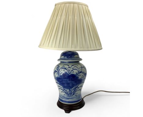 Contemporary Chinese blue and white table lamp, of baluster form with hardwood plinth and shade, H68cm overall 