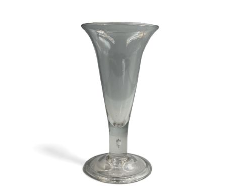 Large 18th century ale glass, circa 1780, with drawn trumpet bowl and flared rim, teardrop stem on a domed folded foot, H20cm