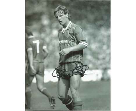 Paul Walsh 10x8 signed b/w photo in Liverpool playing days. Paul Walsh is a former England international footballer who now w