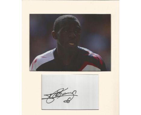 Fabrice Muamba signature piece with mounted photo in Bolton kit. Bolton footballer who was saved from a cardiac arrest while 