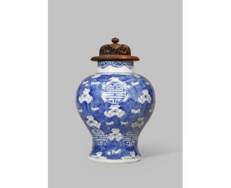 A CHINESE BLUE AND WHITE 'PRUNUS' VASE KANGXI 1662-1722 The baluster-shaped body painted with prunus blossoms and two rows of