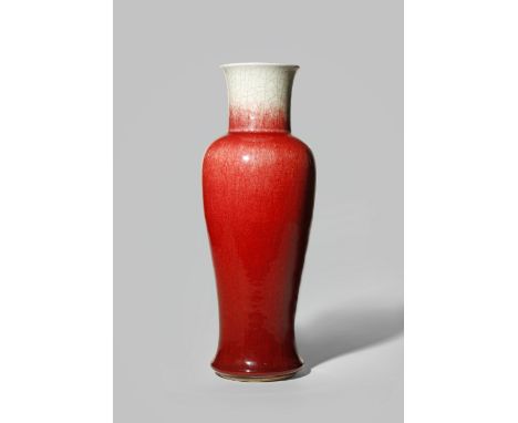 A CHINESE LANGYAO SLENDER BALUSTER VASE KANGXI 1662-1722 With a flared cylindrical neck, decorated with a red crackled glaze 