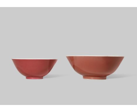 TWO CHINESE RED GLAZED BOWLS 18TH AND 19TH CENTURY The larger with a copper-red glaze to the exterior and a six character Qia