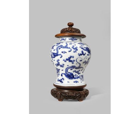 A CHINESE BLUE AND WHITE BALUSTER VASE KANGXI 1662-1722 Painted with six sinuous chilong amongst stylised clouds and floral s