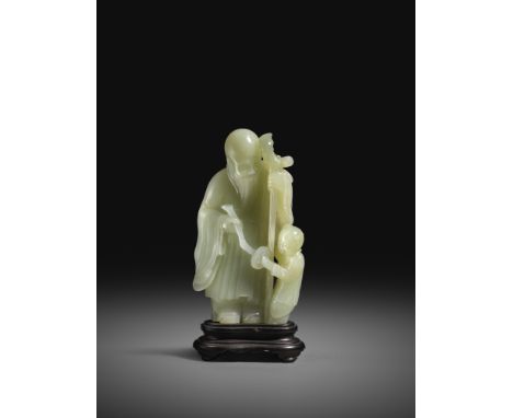 A CHINESE WHITE JADE CARVING OF SHOULAO 18TH CENTURY The Immortal stands, leaning on a staff with a scroll tied to its top, h