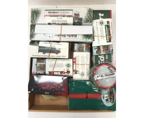 Six Atlas Editions Eddie Stobart Collection models, together with notepad and place-mats, and an Atlas Editions Fire Engine. 