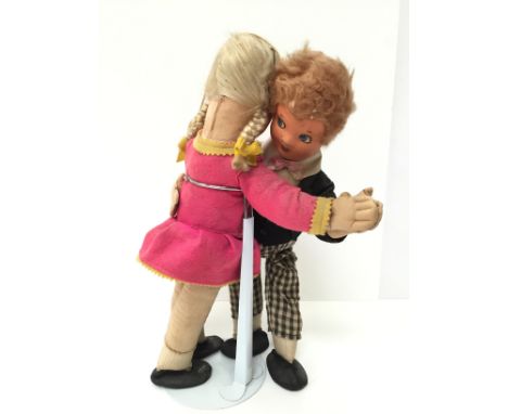 Dean's Rag Book Dancing Dolls: male and female cloth dolls with moulded painted faces and felt clothing. Deans logo to feet. 