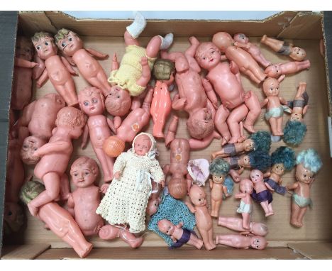 Quantity of Japanese celluloid dolls, includes kewpie style with blue hair. Sizes vary 19cm-9cm. Overall F-G. (35)