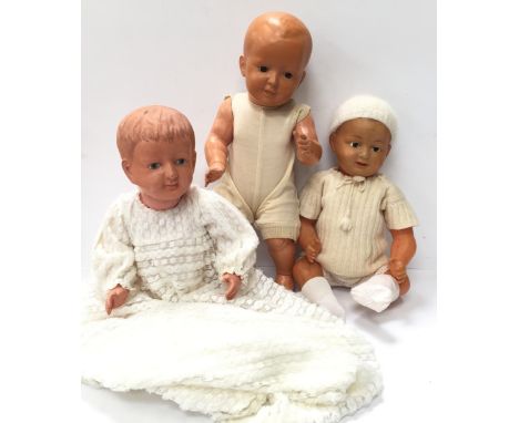 Three large celluloid dolls: Schildkrot (Germany) '55' doll with fixed brown eyes, height 51cm; SNP (France) doll with blue s