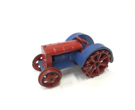 Dinky Toys 22 Tractor, pre-war model in red and blue with red wheels and towing hook. G, signs of fatigue to front right whee