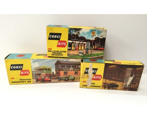 Three Corgi Kits: 605 Silverstone Timekeeper's Box (G box); 606 Corgi 2 x Lamp Standards (G/F box with surface tears to one s
