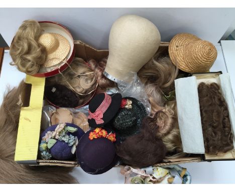 Quantity of doll's wigs, includes real hair - one hair piece in box with inscription 'Edith M.Mouliers' hair made up 1938' - 