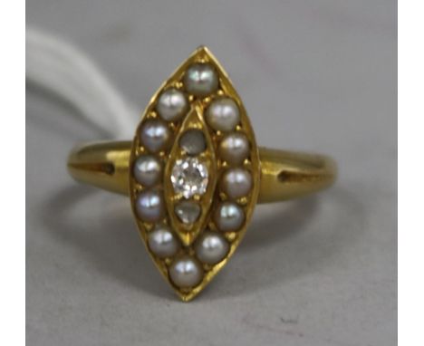 An Edwardian yellow metal, split pearl and diamond marquise shaped ring, size K.