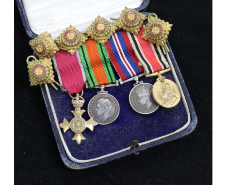 A cased group of miniatures including MBE and six epaulette pips