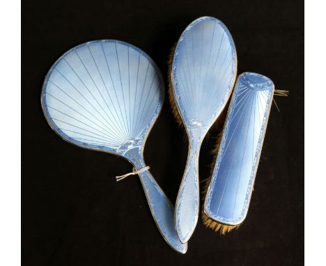 A 1930's silver and blue enamel three piece brush and mirror set.