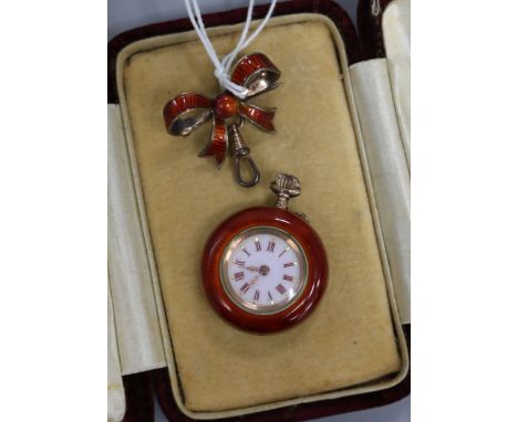 A continental silver gilt and red guilloche enamel fob watch with similar bow suspension brooch.