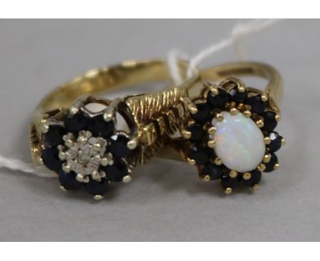 An opal and sapphire cluster ring and an illusion-set diamond and sapphire cluster ring, 9ct gold settings.