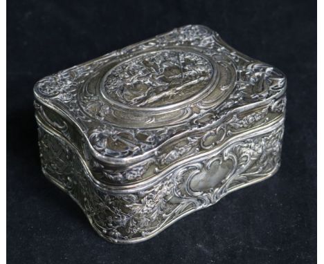 A Continental 19th century silver (800) and silver-gilt trinket box, of shaped rectangular form, embossed to hinged cover and