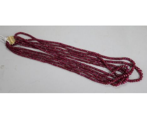 An Indian multi strand facet cut ruby necklace, 52cm.