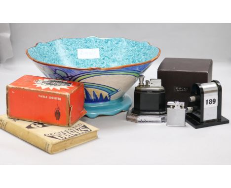An Art Deco lighter, a calendar, a bowl, etc.