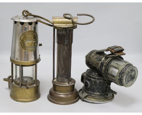 Two miners lamps and a bicycle lamp