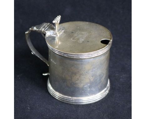 A 1920's silver drum shaped mustard pot with plated ladle.