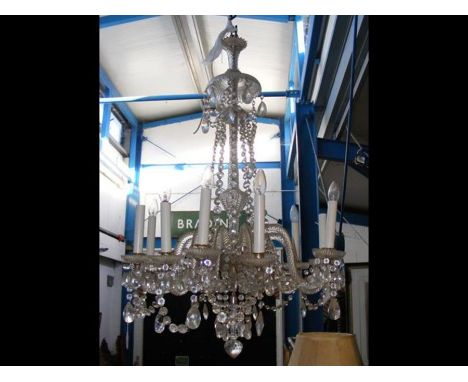 An antique crystal multi-branch chandelier - 120cms in length, 70cms in diameter