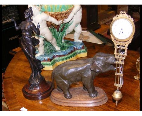 An elephant 'mystery' clock - 28cms high, together with a 30cm high 'mystery' clock figure only