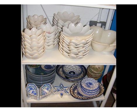 Assorted Italian ceramic bowls, together with blue and white ceramics - on two shelves