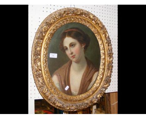 An antique oval oil portrait of demure looking lady - 39cm 