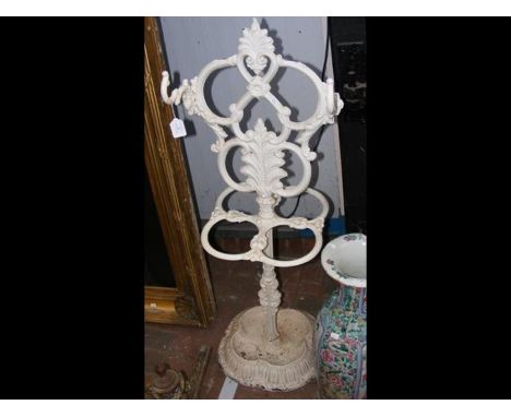 A white painted wrought iron umbrella/stick stand 