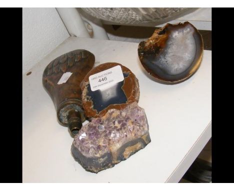 A copper powder flask together with three geological specimens