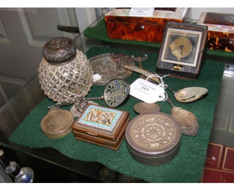 A travelling clock, scent bottle, etc. 