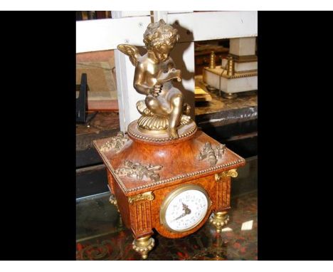 A small decorative French burr walnut and ormolu mantel clock - 28cm high 