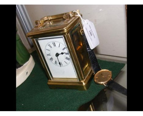 A brass cased carriage clock, together with an Omega lady's wrist watch 
