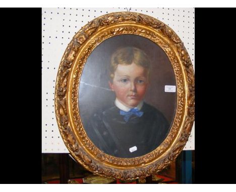 An antique oval oil portrait of young boy - 38cm 