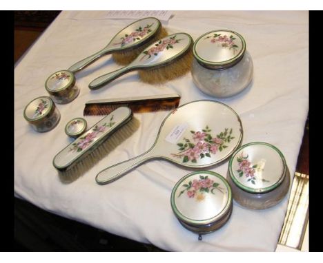 A silver and enamel dressing table setCONDITION REPORTEach item in the set is hallmarked.We have attached a number of additio