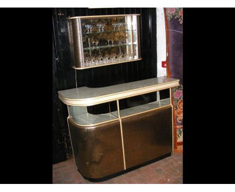 A Barget Uil of London mid century curved cocktail bar finished with formica top, light up glass display and retro black and 
