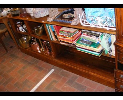 A low walnut two shelf bookcase - width 195cms