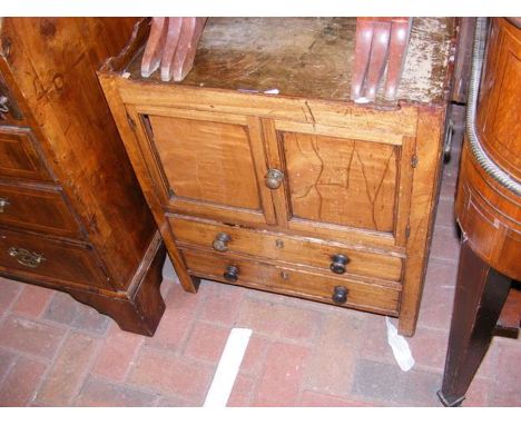 A Georgian mahogany commode with tray top