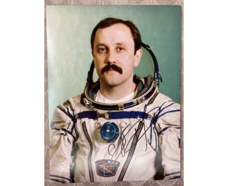 Cosmonaut Yuri Usachev Portrait signed 10 x 8 colour photo in Space Suit. Astronaut. Good condition. All autographs come with
