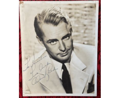 Veteran actor Alan Ladd signed 10 x 8 inch sepia portrait photo, dedicated to Heather. Tape marks to back. Good condition. Al