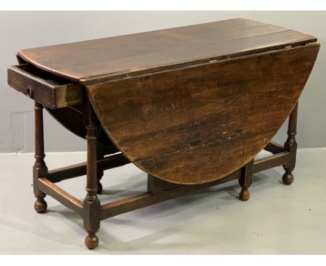 ANTIQUE OAK GATE LEG DINING TABLE, twin flap with planked top and single end drawer, on turned and block supports, 73cms H, 1