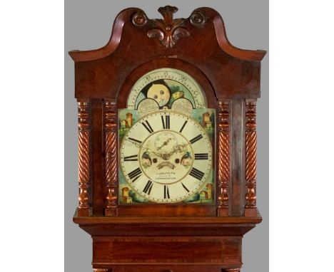 VICTORIAN MAHOGANY LONGCASE CLOCK by J Griffith, Carnarvon, having a painted moon phase arched top dial set with Roman numera