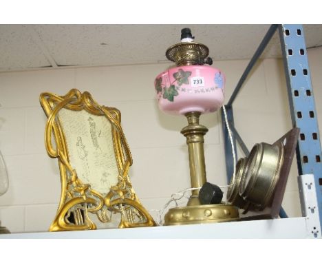 AN ART NOUVEAU STYLE GILT RESIN PHOTOGRAPH FRAME, inner dimensions 24cm x 17cm approximately, together with a late Victorian 