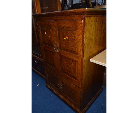 AN OAK FALL FRONT TV CABINET, together with three brass table lamps and two ceramic lamps (6)