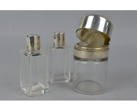 THREE SILVER TOPPED COSMETIC JARS