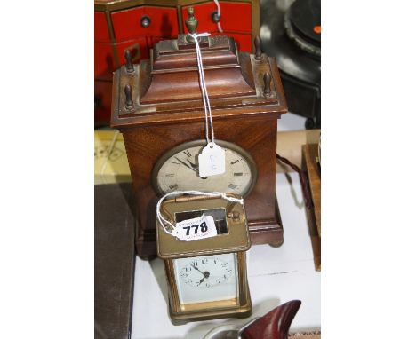 AN EARLY 20TH CENTURY BRASS CASED CARRIAGE CLOCK, French movement, together with an early 20th Century mahogany cased mantel 